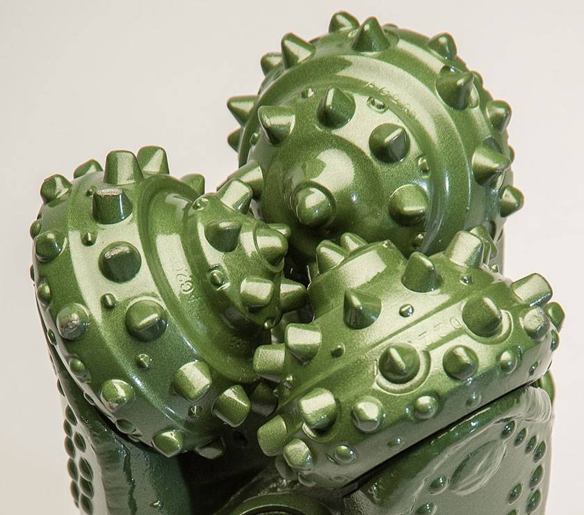 Green tricone drill bit with tungsten carbide insert cutters