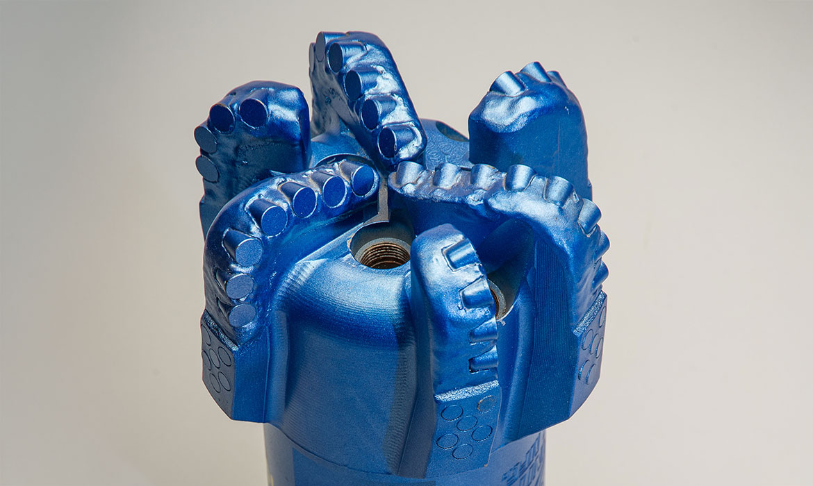 Blue PDC drill bit with polycrystalline diamond cutters. for the contact KS Bit page.