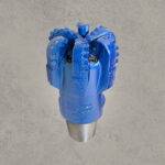 Blue PDC drill bit with polycrystalline diamond cutters and threaded connection.