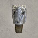 Front view of mill tooth tricone drill bit with sealed bearing and steel milled teeth.