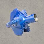 Angled view of blue PDC pull reamer bit with cutting blades