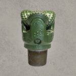 Front view of TCI tricone drill bit with sealed bearing and tungsten carbide insert buttons.