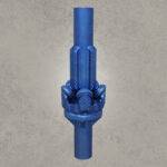 Tricone hole opener mounted on drill string with tungsten carbide insert cutters.